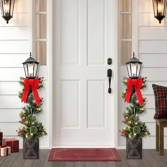 Puleo International 4ft. Pre-Lit Pinecones, Berries & Red Bow Artificial Spiral Lamp Post Trees, 2ct.